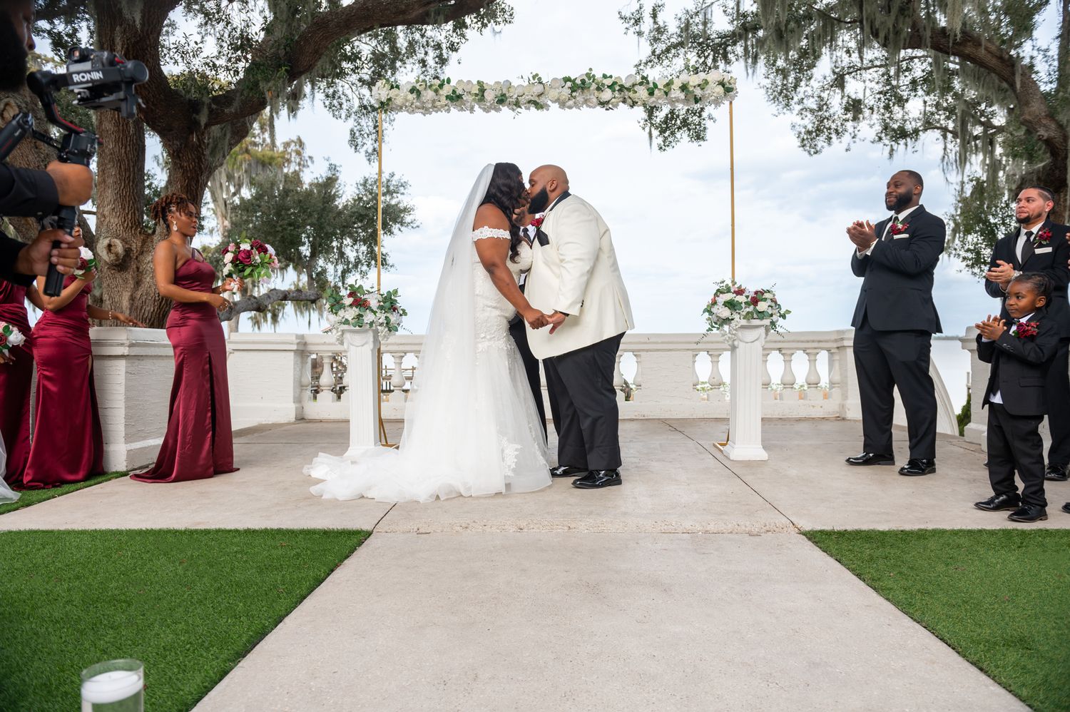 Elegant lakefront ceremony at Bella Cosa in Lake Wales, styled by luxury wedding photographers in Florida.