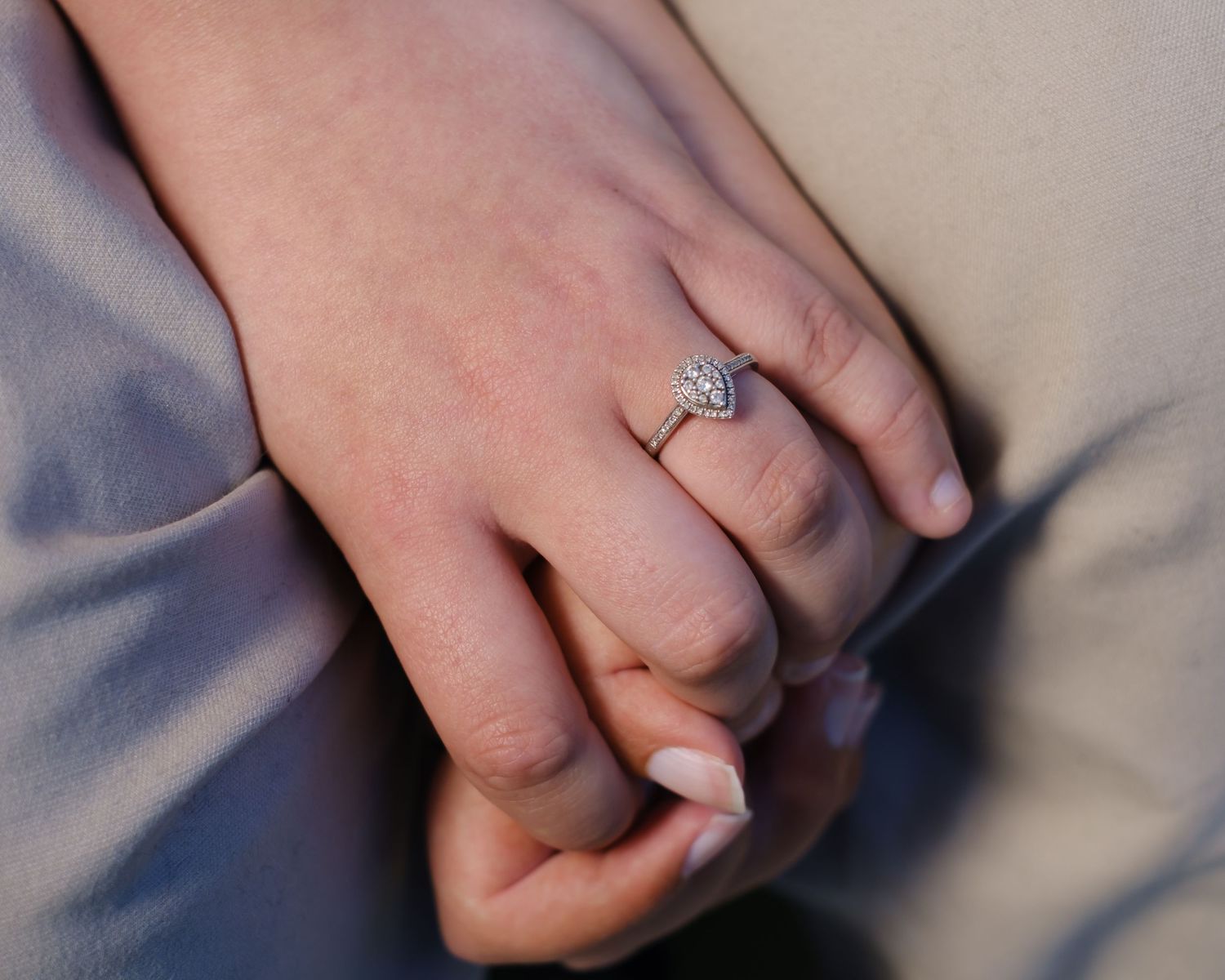 Lucy showing off her beautiful engagement ring whilst holding Owen's hand.