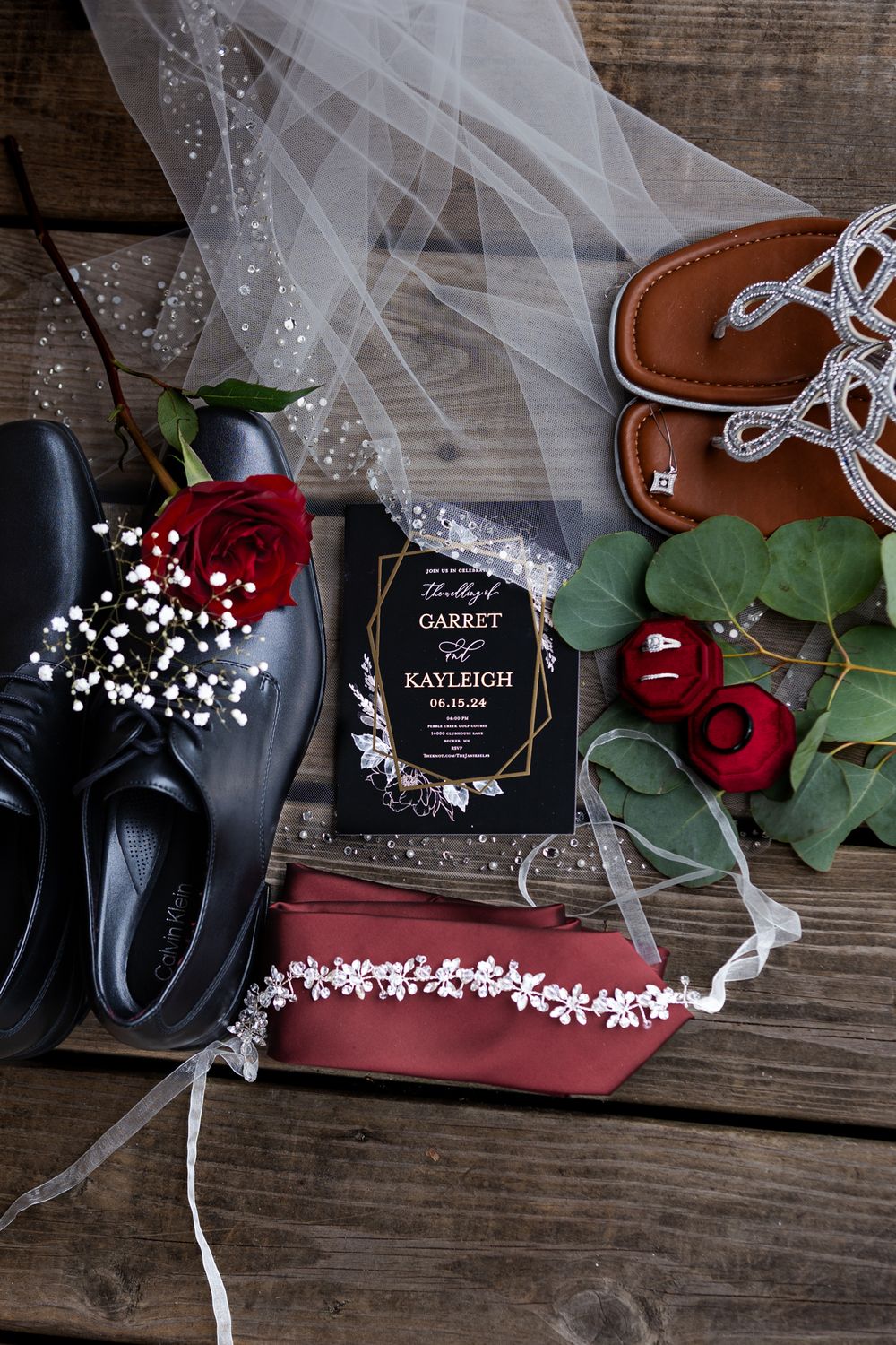 wedding details laid out on wooden deck