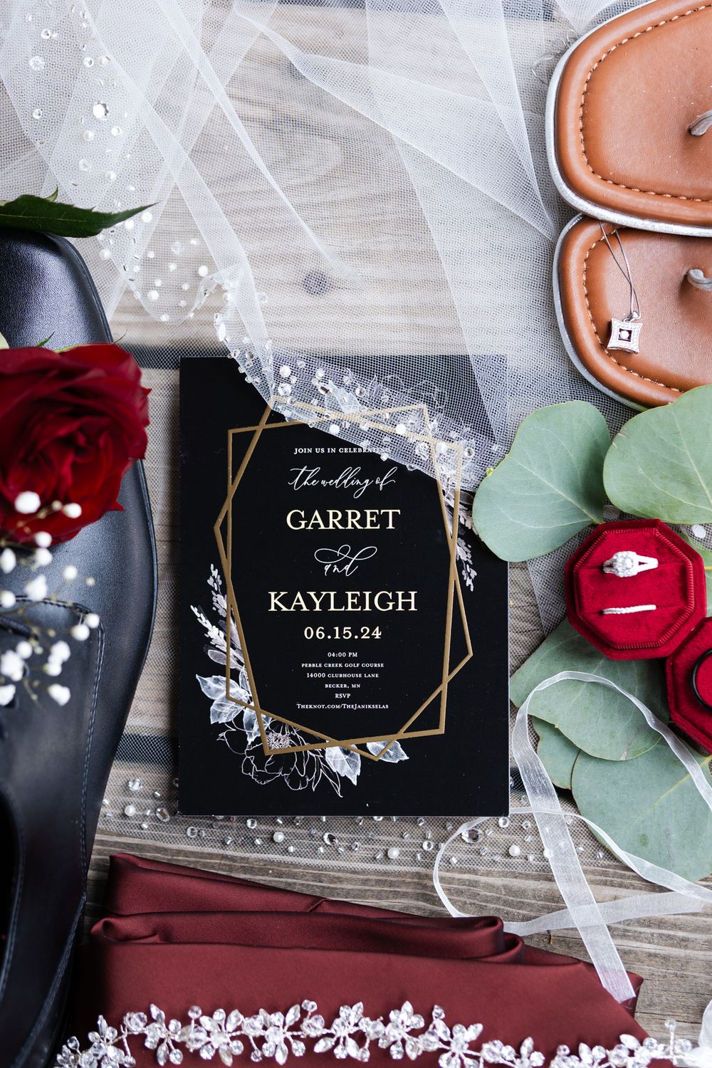 wedding details laid out on wooden deck