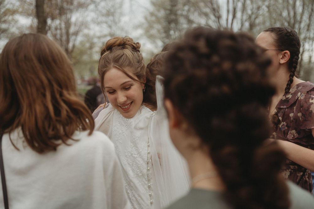 Wedding guests gather outdoors for a celebration in casual attire.