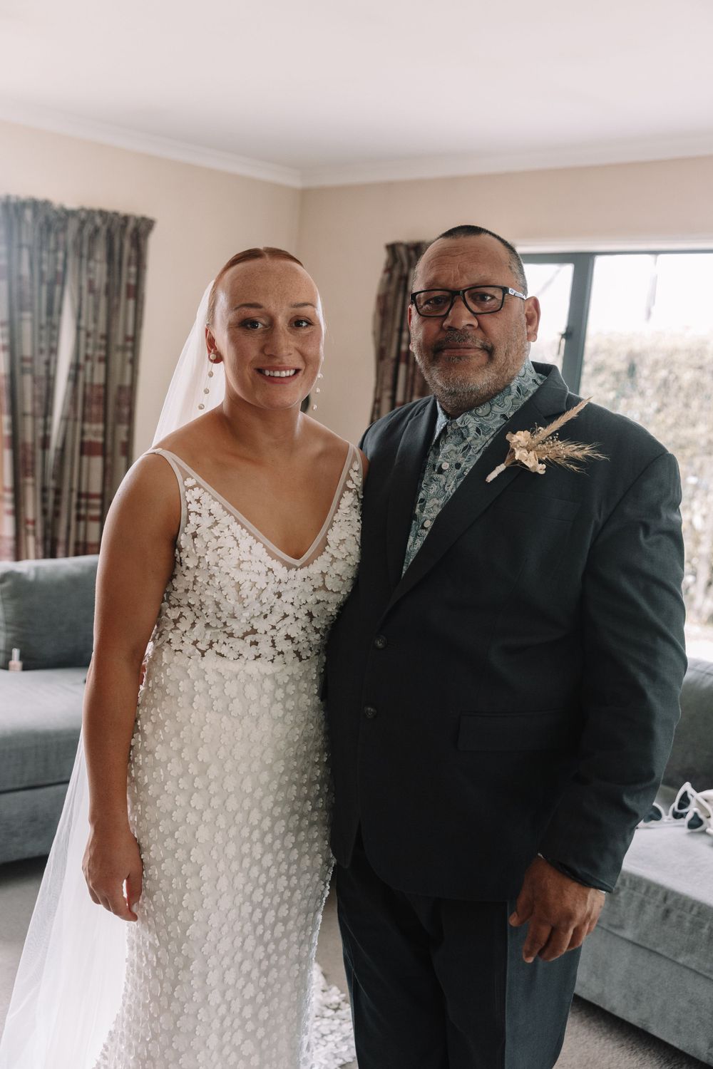 A heartwarming wedding day portrait featuring elegant attire and genuine smiles.