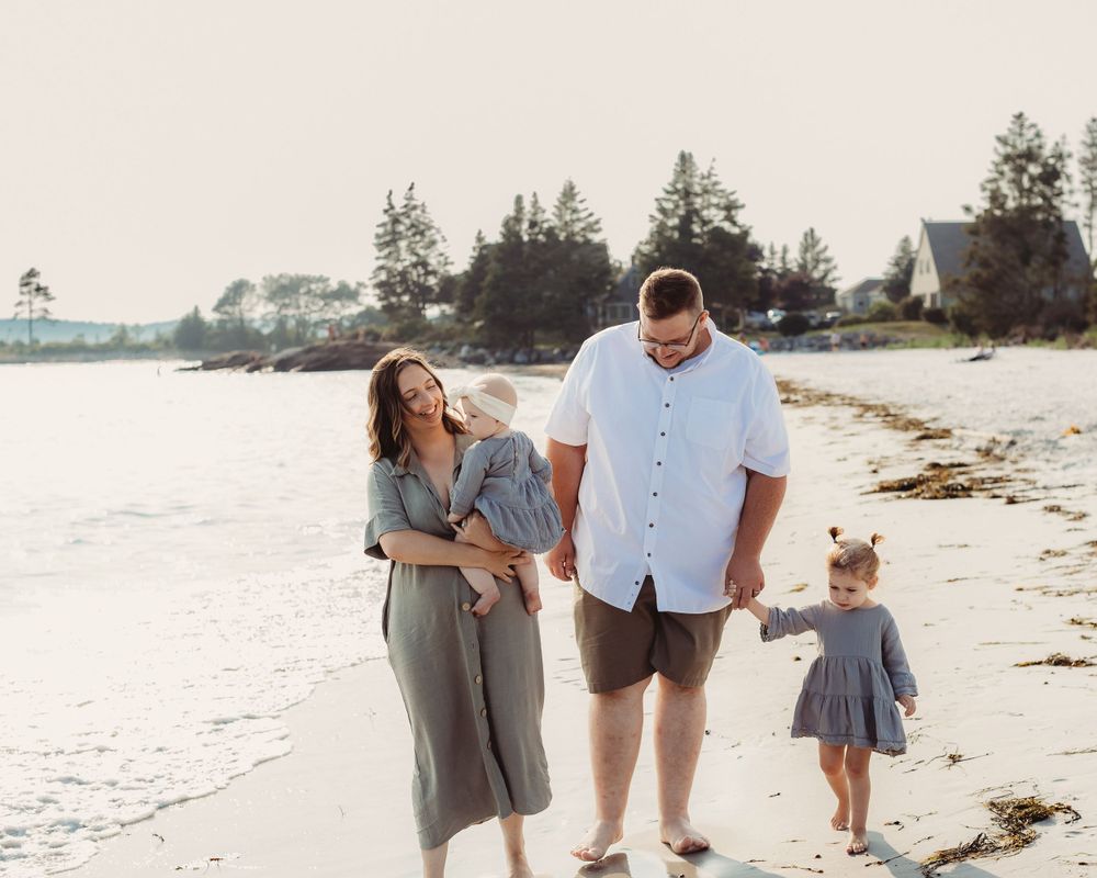 Professional photo of a family of three on the beach