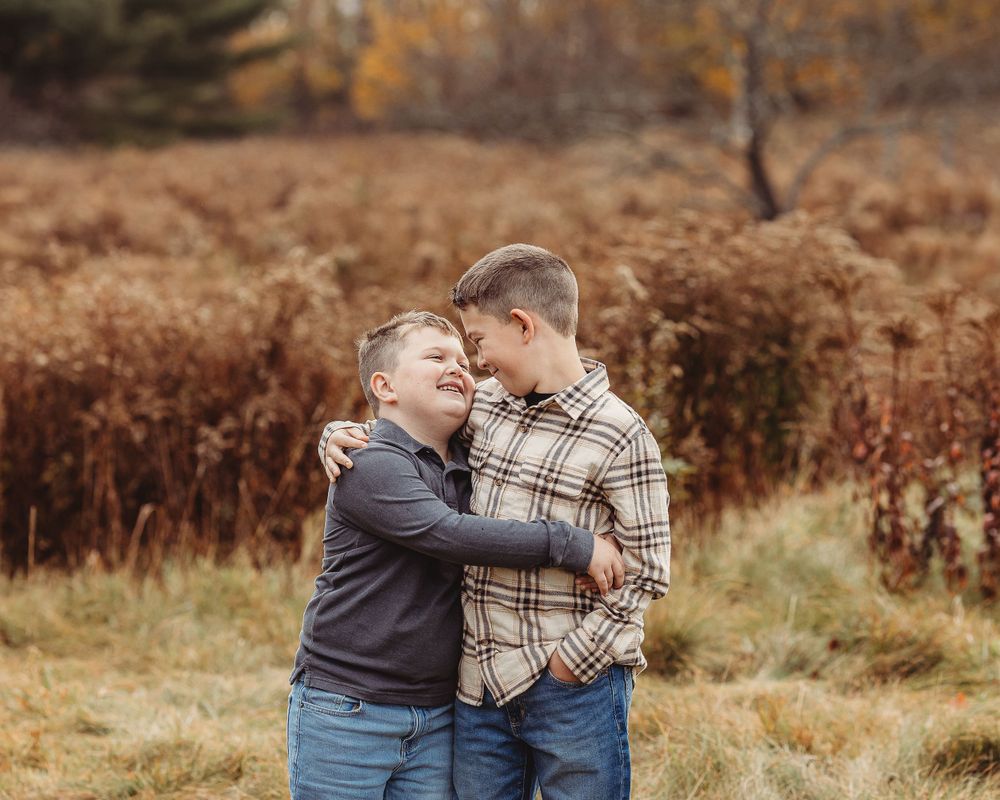 Professional photo of two brothers hugging