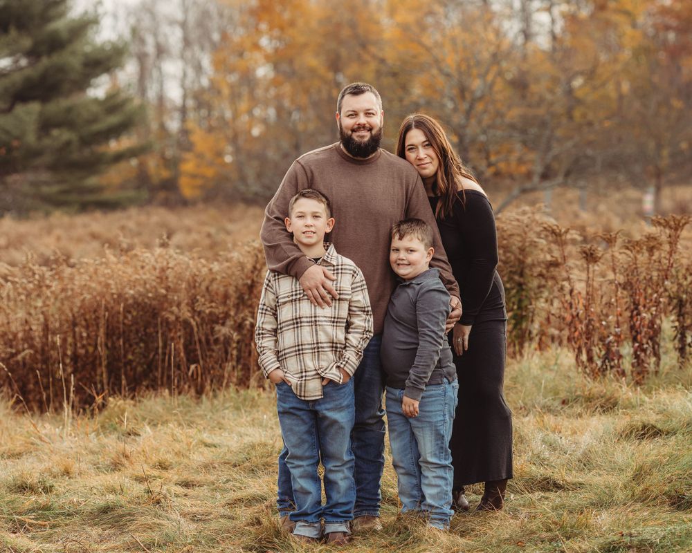 Professional photo of a family of four outdoors