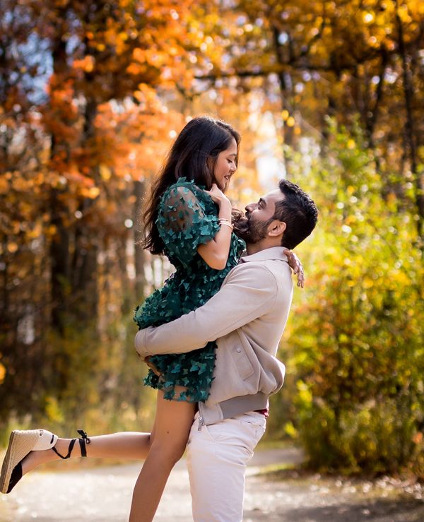 Toronto engagement photo, couple laughing in park