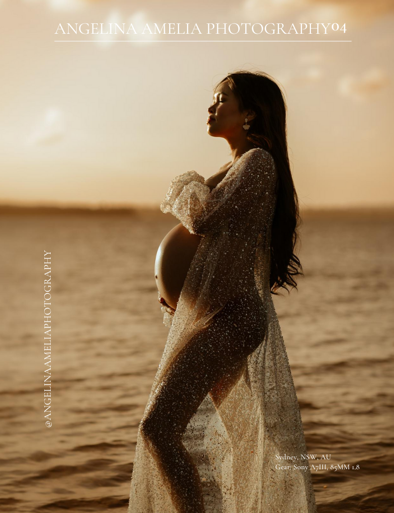 A silhouetted pregnant figure in a sheer dress stands against a golden sunset over water, creating a dreamy maternity portrait.