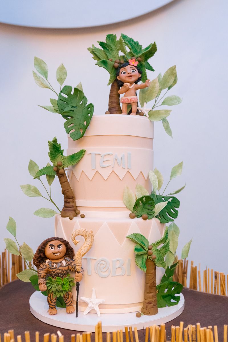 Two beautifully decorated Moana-themed birthday cakes featuring tropical designs, captured by NYC family photographer Paula Brearley.