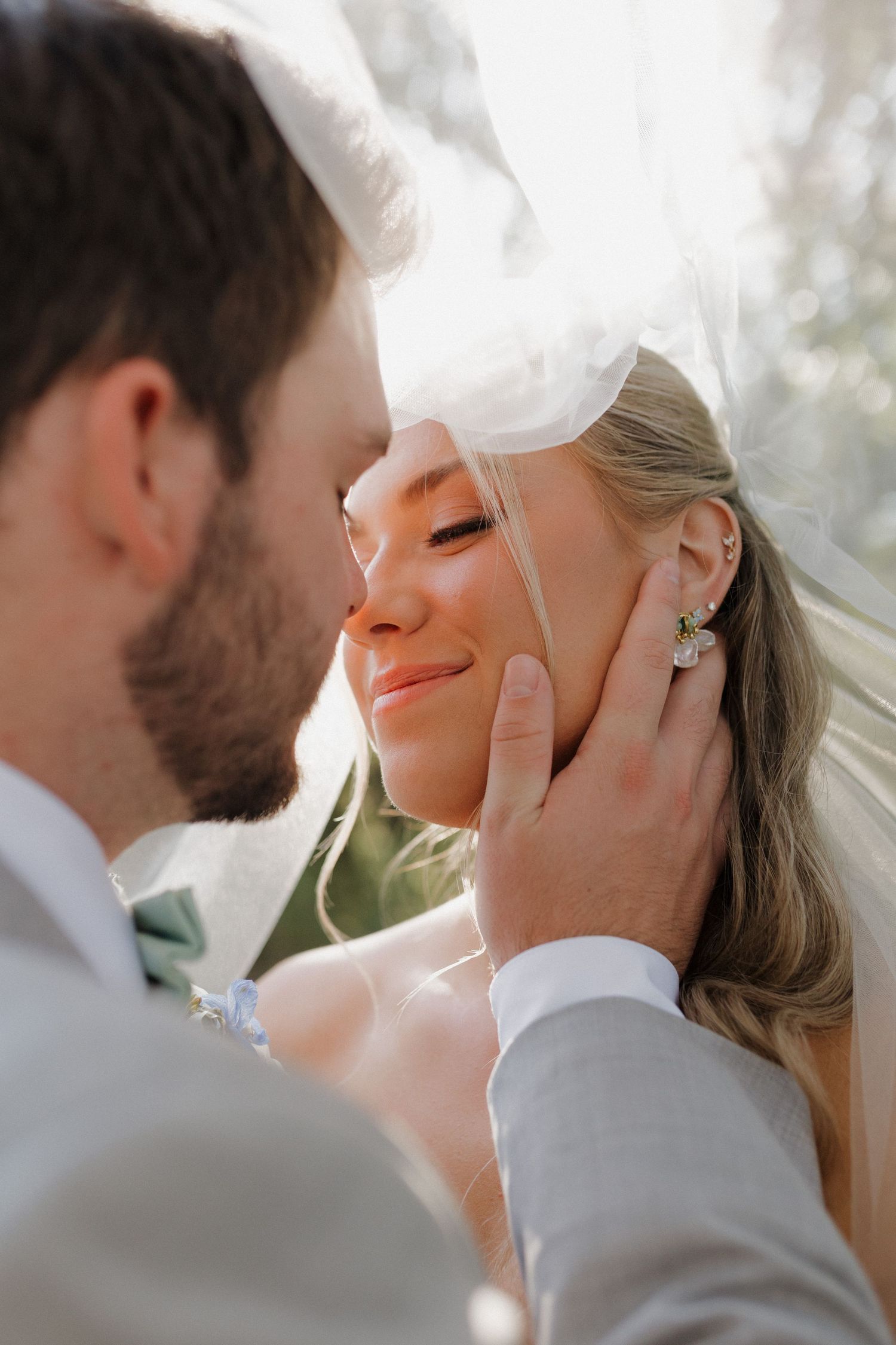 A tender moment captured between a couple during their outdoor wedding ceremony.