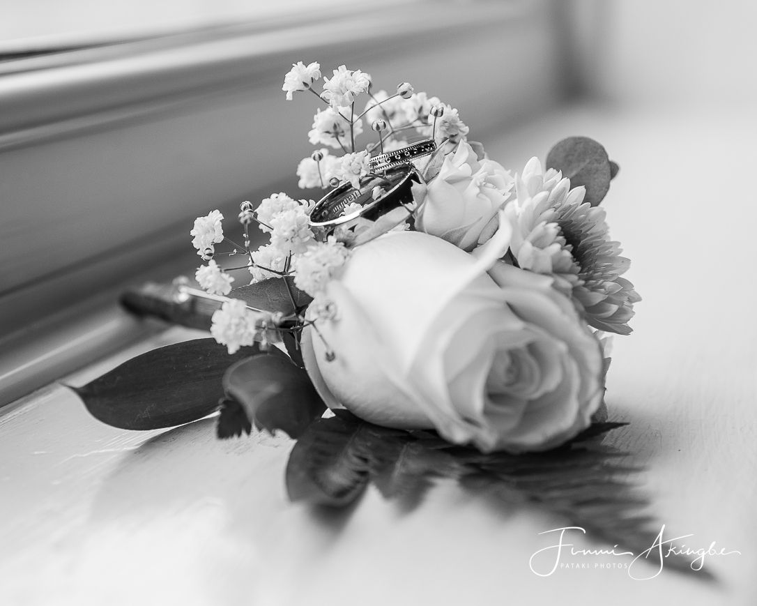 Wedding day flower and ring detail, captured by Pataki Photos