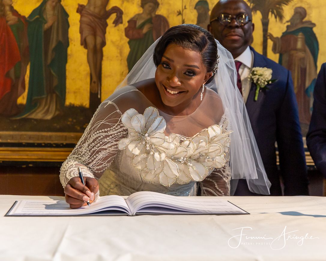 Wedding day church registry signing, captured by Pataki Photos