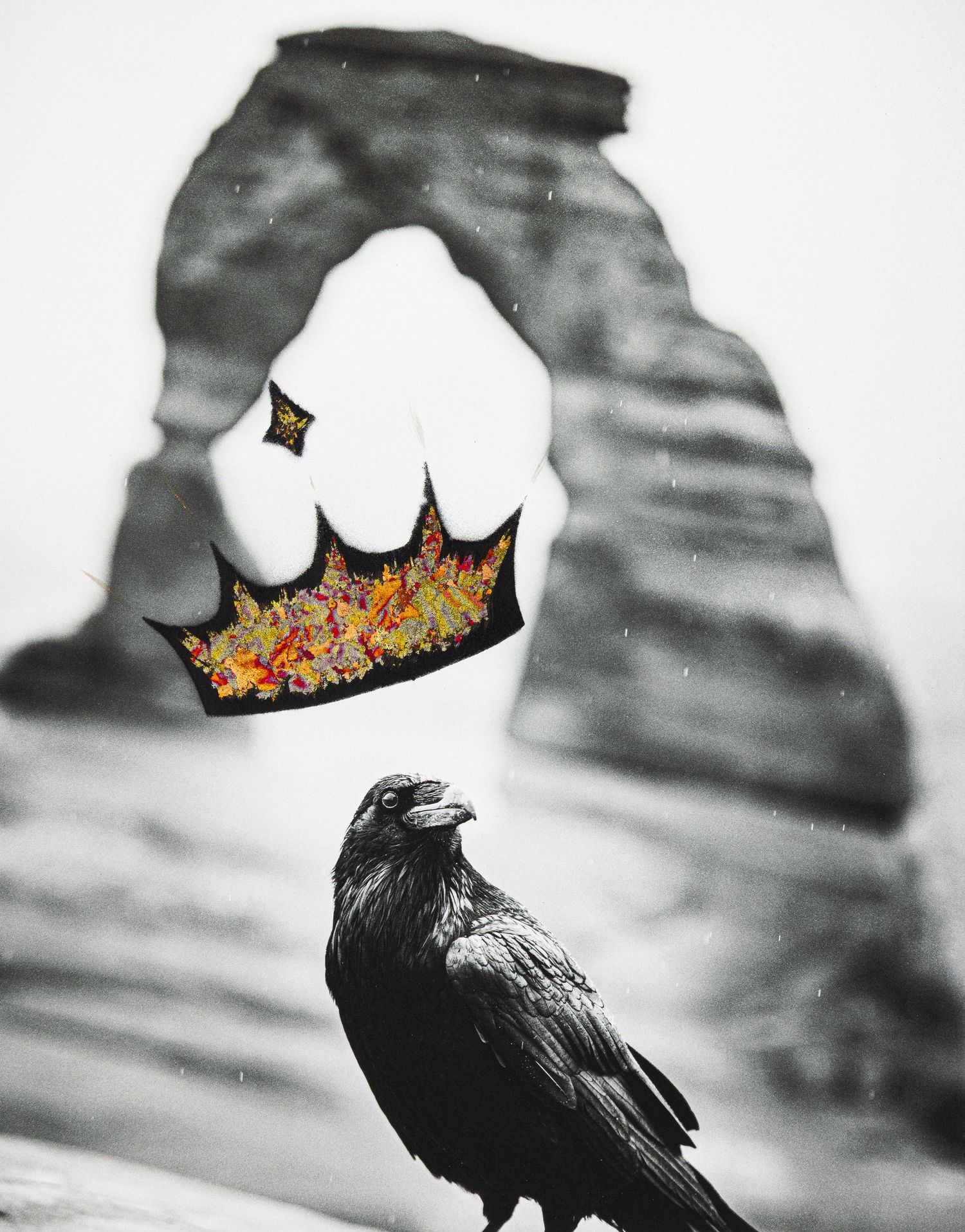 A black raven stands beneath a natural rock arch with a colorful crown effect in moody black and white photography.