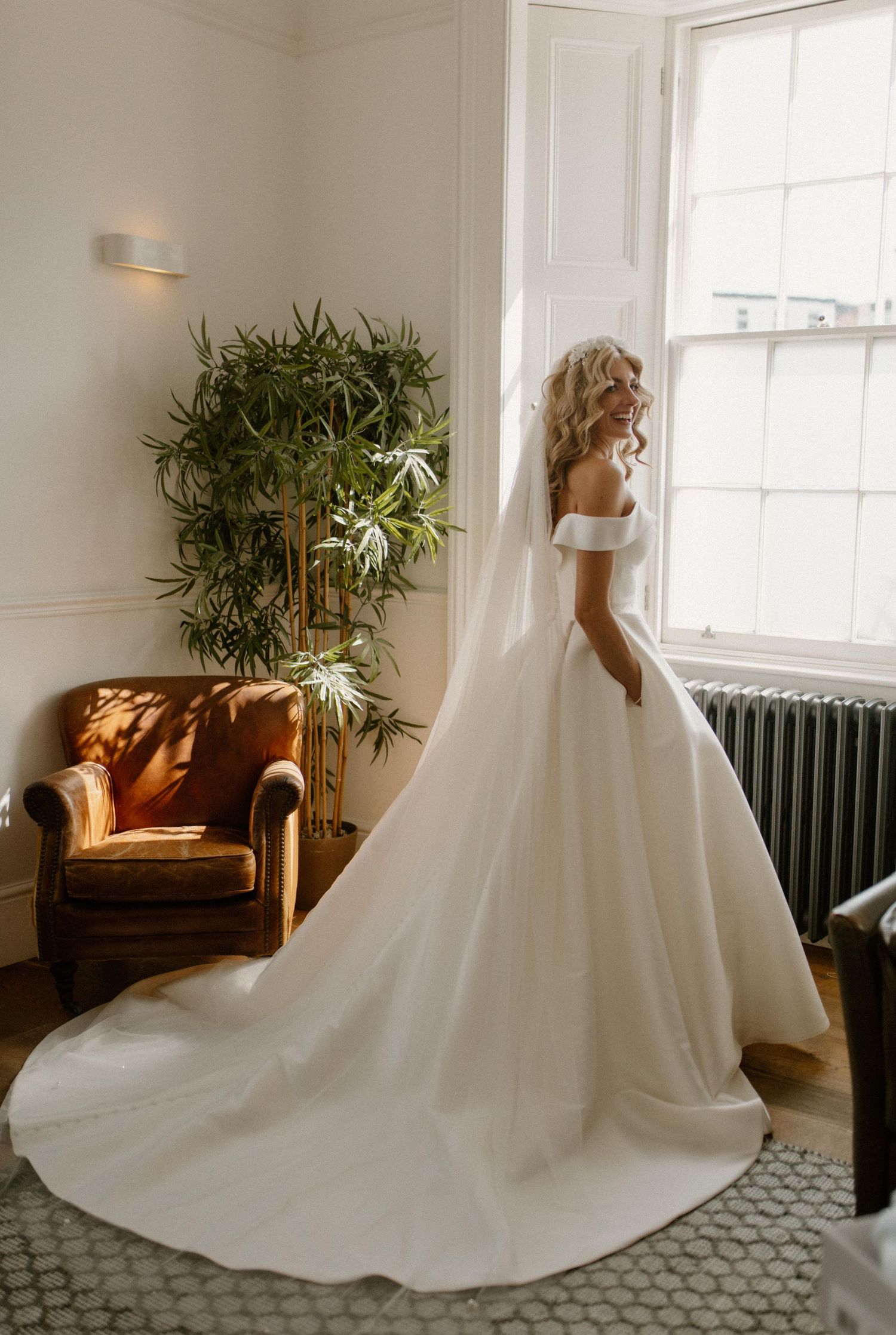 Bride in elegant beach wedding dress at Tunnels Beaches