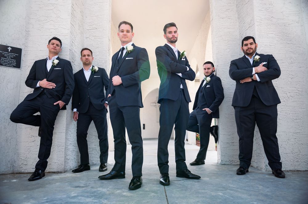 Groom laughing with groomsmen before the ceremony at Tampa Palms wedding venue