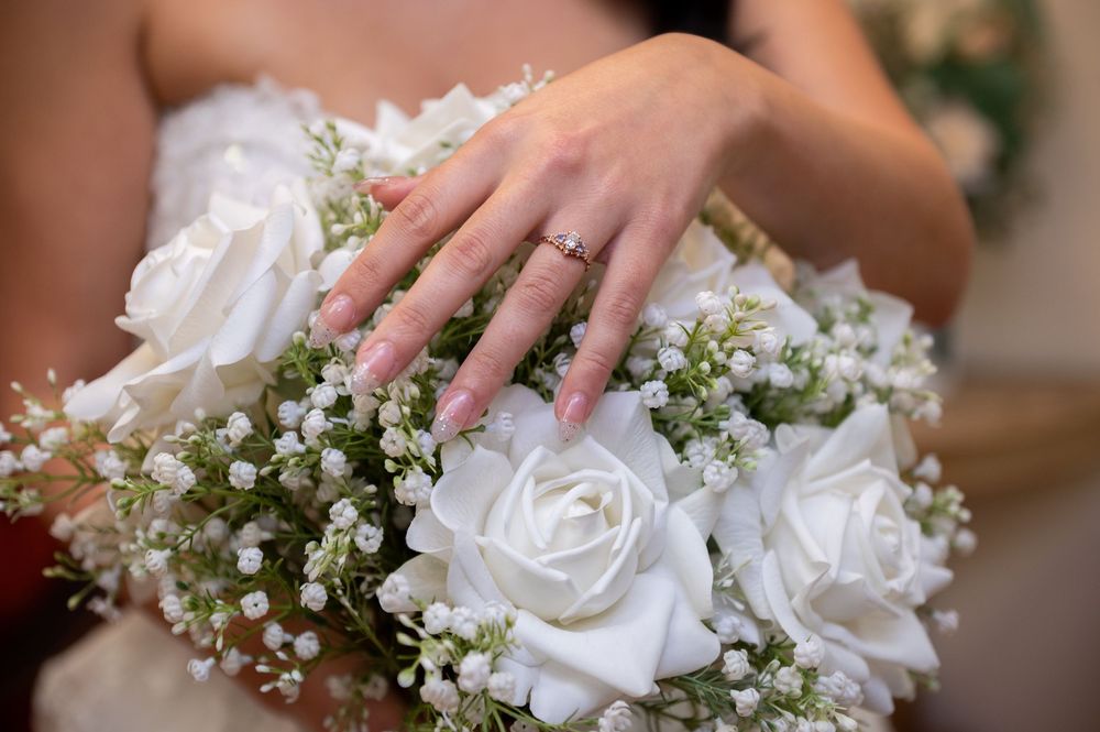 Romantic bridal portrait with soft pink and white bouquet at Canterbury Hall in Tampa