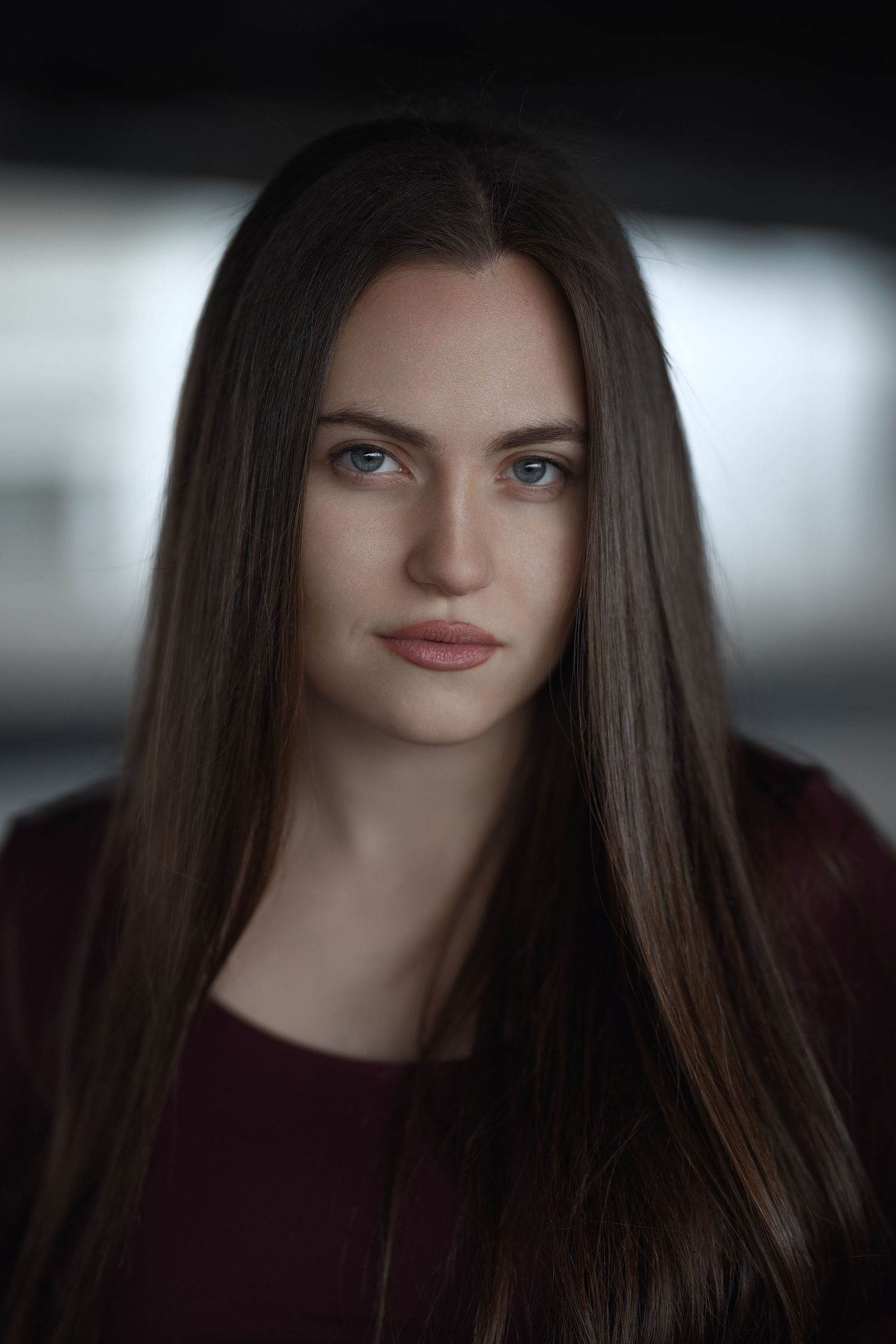 Professional portrait series showing different angles of a model wearing a white sleeveless top against a dark brown backdrop.