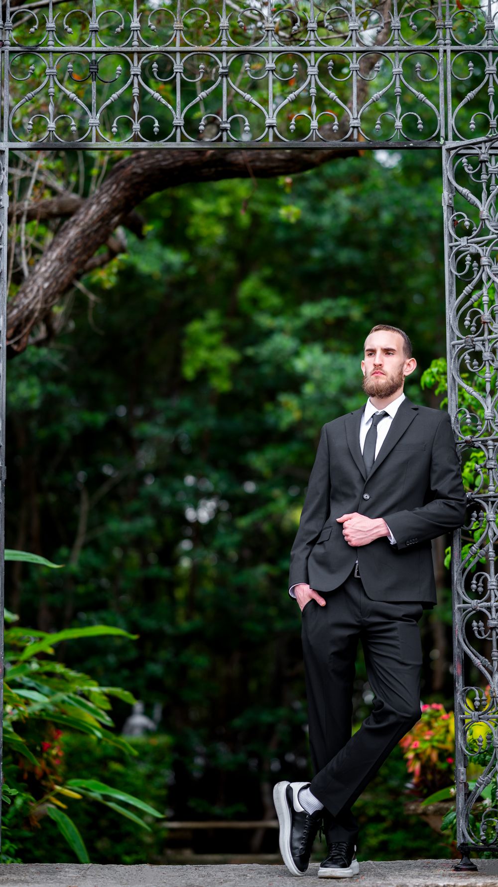Walking along Vizcaya’s stone garden path, captured by wedding photographers in South Florida with a documentary touch.