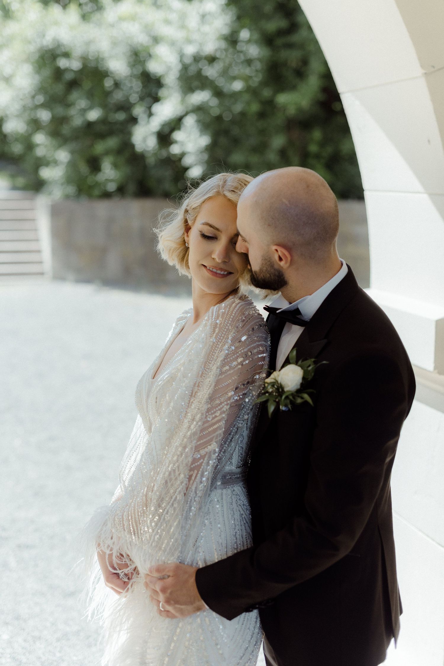 A romantic moment between newlyweds sharing an intimate dance at their wedding reception.