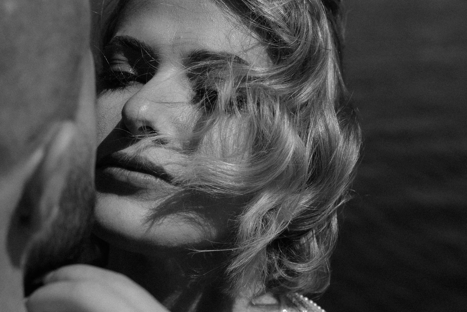 Vintage black and white portrait series showing close-up profile shots of a woman with blonde hair smoking cigarettes.