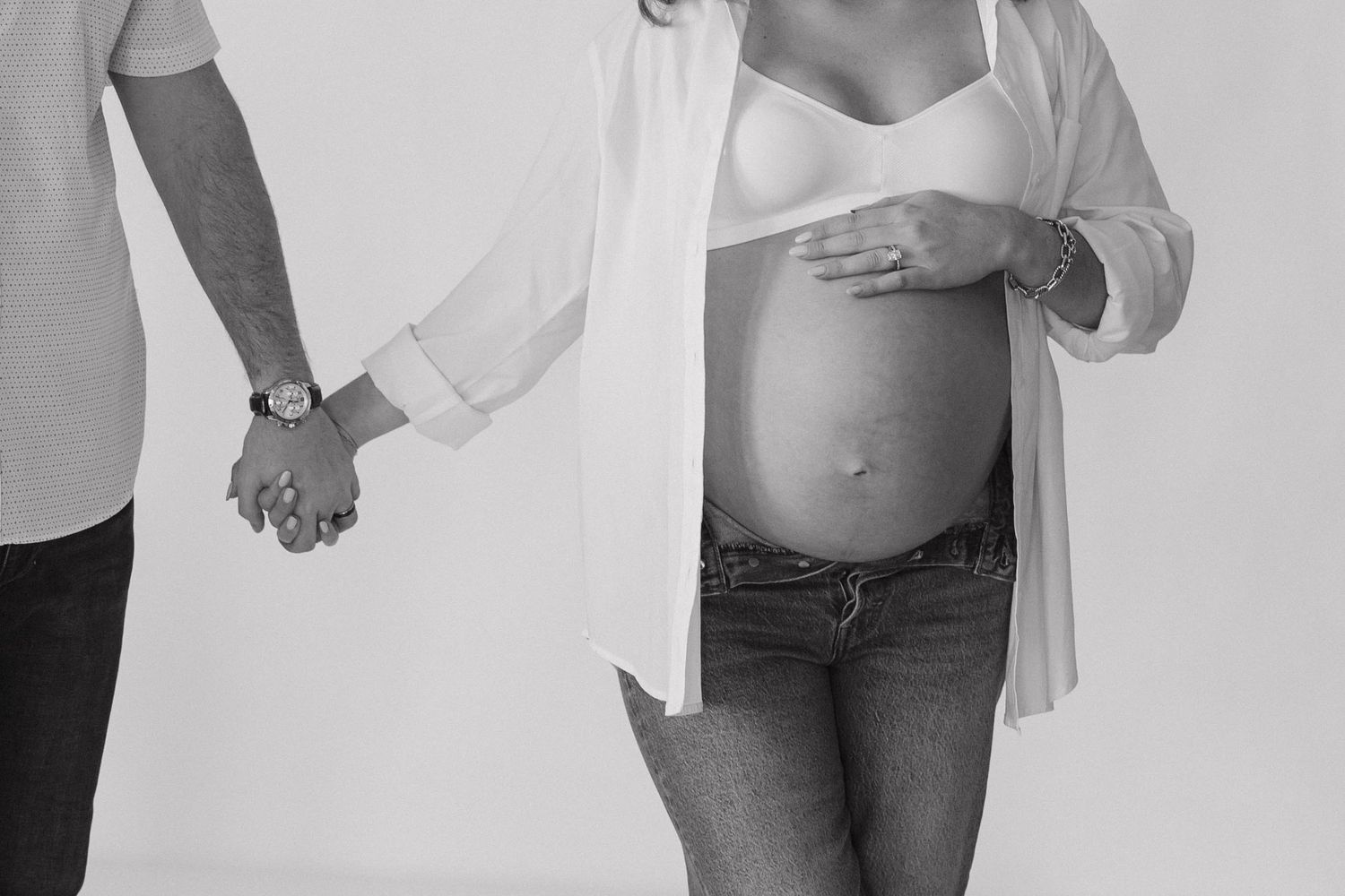 Artistic black and white maternity photography series showcasing pregnancy silhouettes.