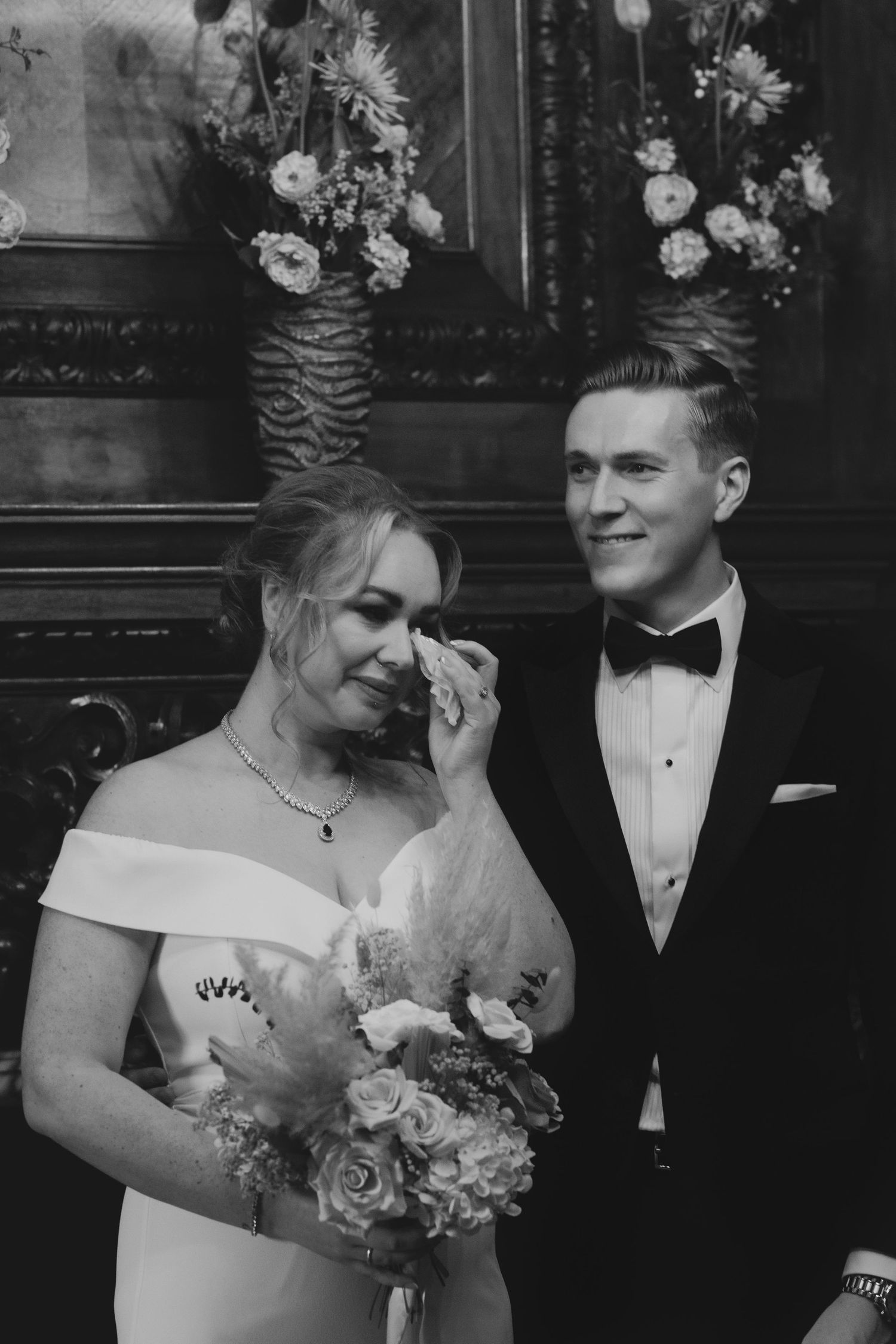 A sequence of four candid photos showing bridal party members laughing together on stone steps with white columns.