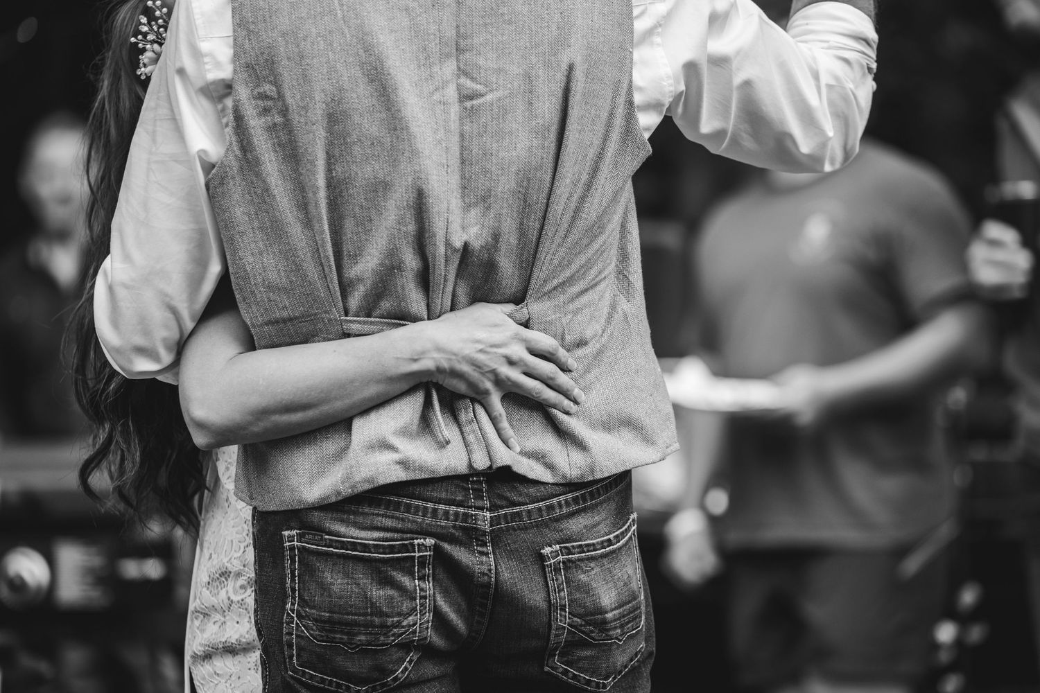 Black and white intimate embrace capture showing couple's tender moment.