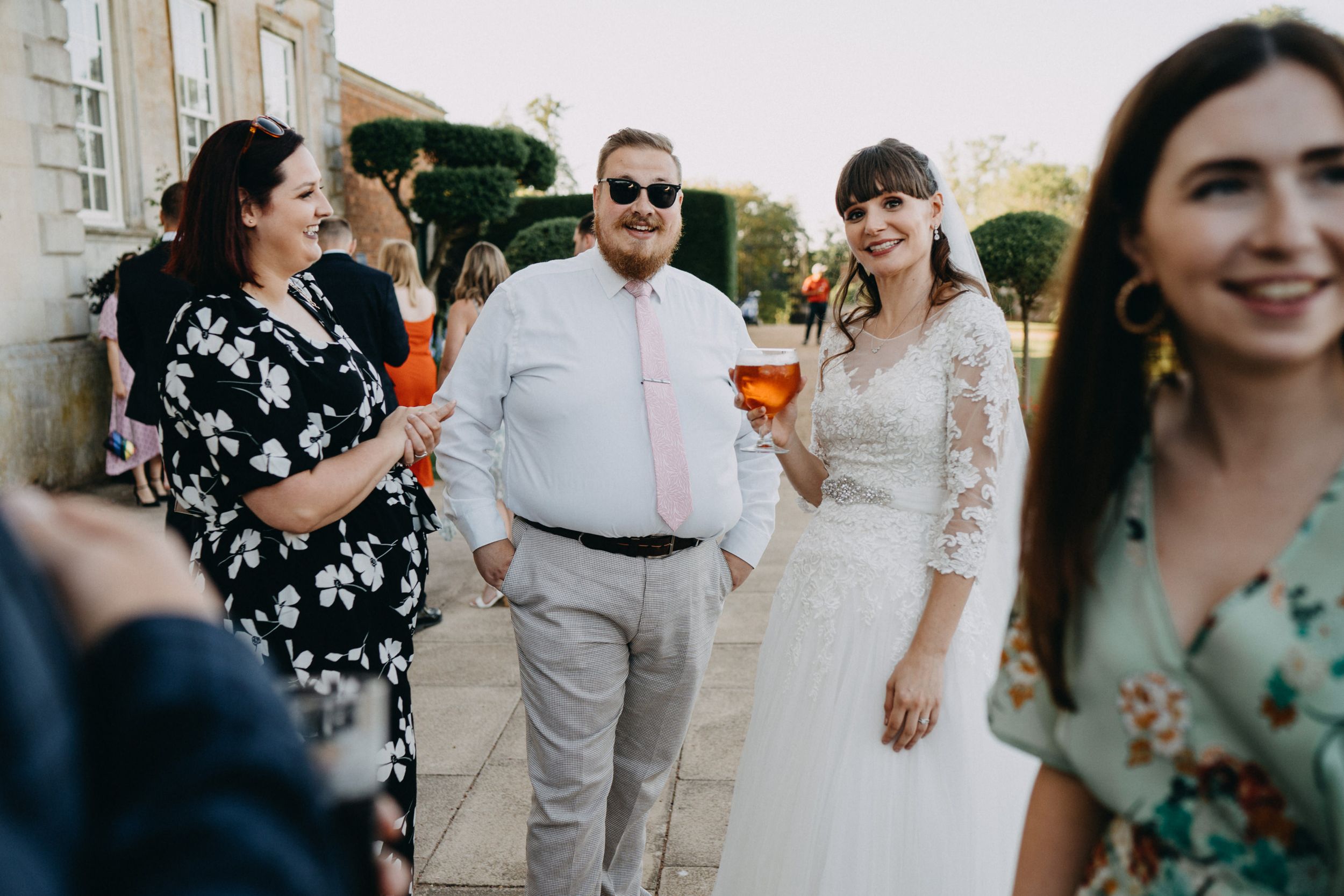 Wedding guests mingling and socializing at an elegant outdoor venue.