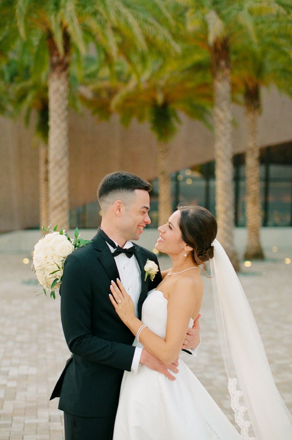 A romantic wedding couple sharing an intimate moment together at the Winter Park Events Center
