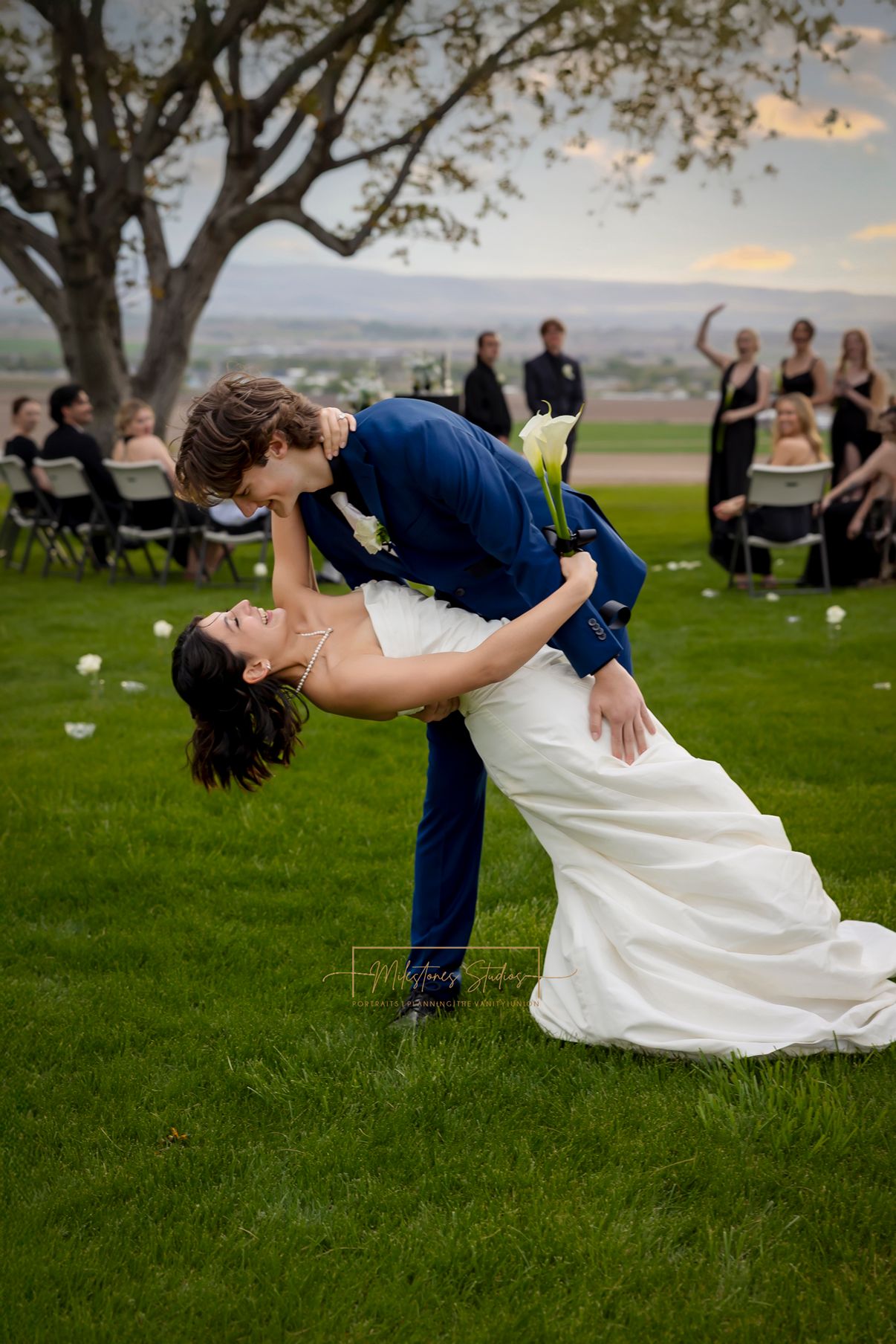 Groom dipping bride at the end of the aisle at Garman Hill