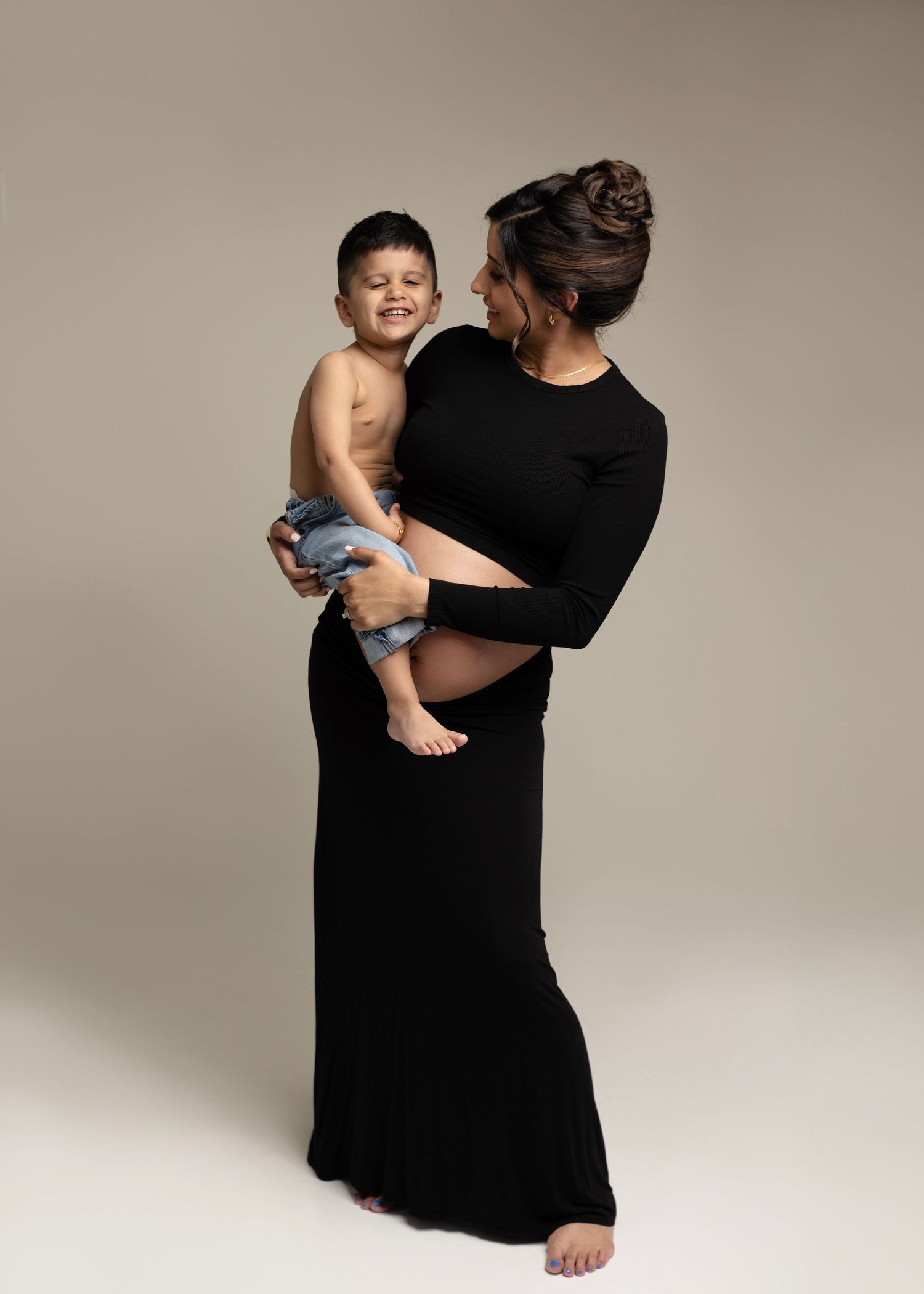 Gorgeous Rumneet awaits her new baby's arrival. Cloverdale. Surrey. Maternity Photography bump photos. Sleek black dress with cutout.