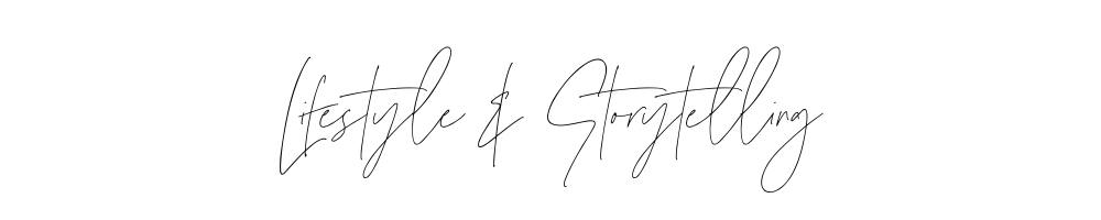 Hand drawn designer signature text in black ink against white background.