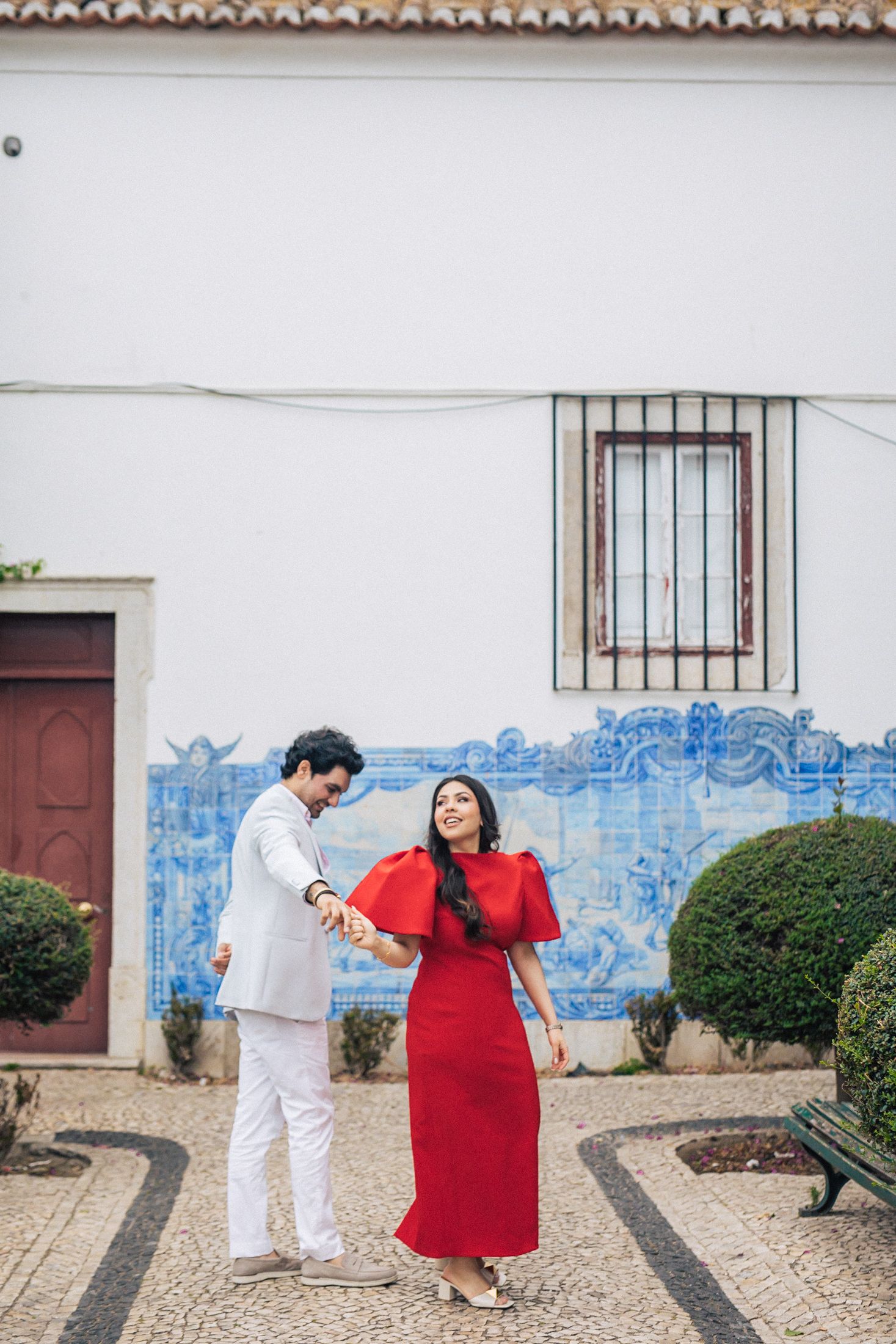 Romantic pre-wedding shoot in Lisbon with an Indian couple exploring historic city landmarks.