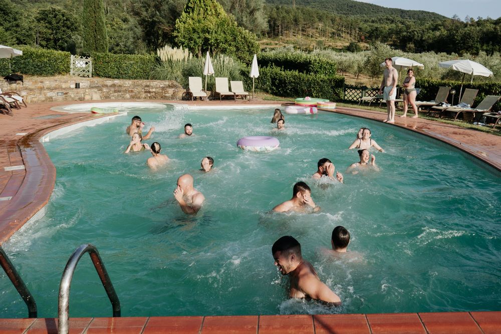 Everyone having fun at the pre-wedding party at the pool