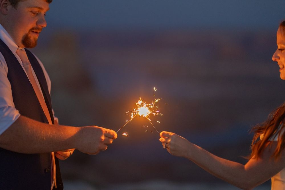 couple looking at each other at sunset over lake Powell