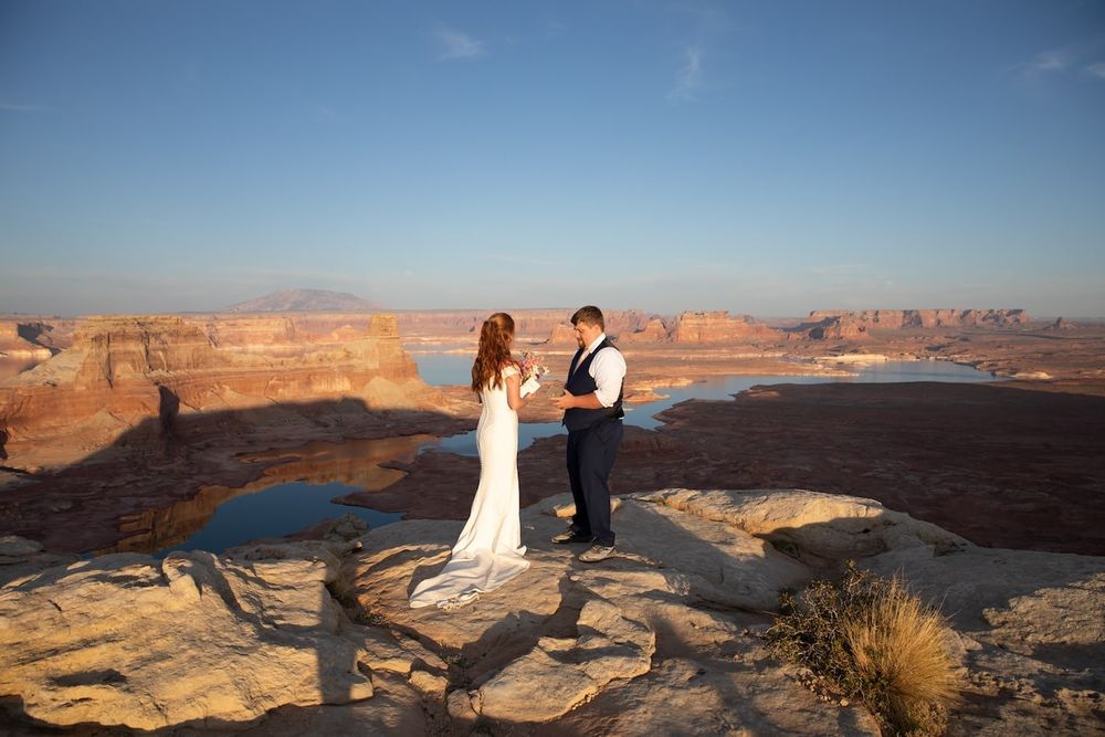 couple looking at each other at sunset over lake Powell