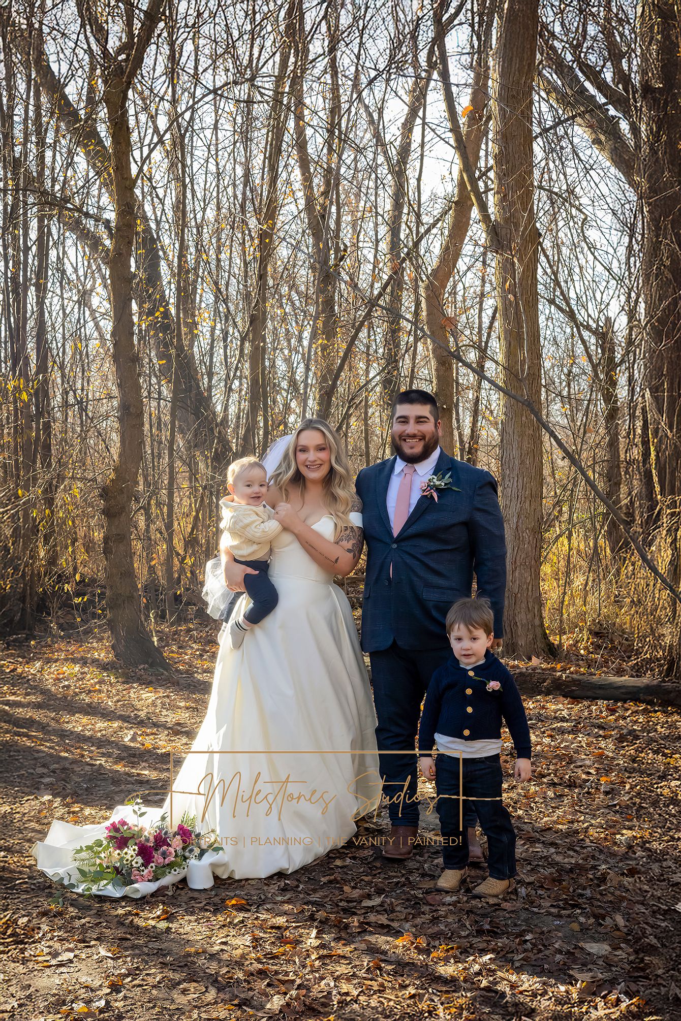 bride and groom with 2 sons