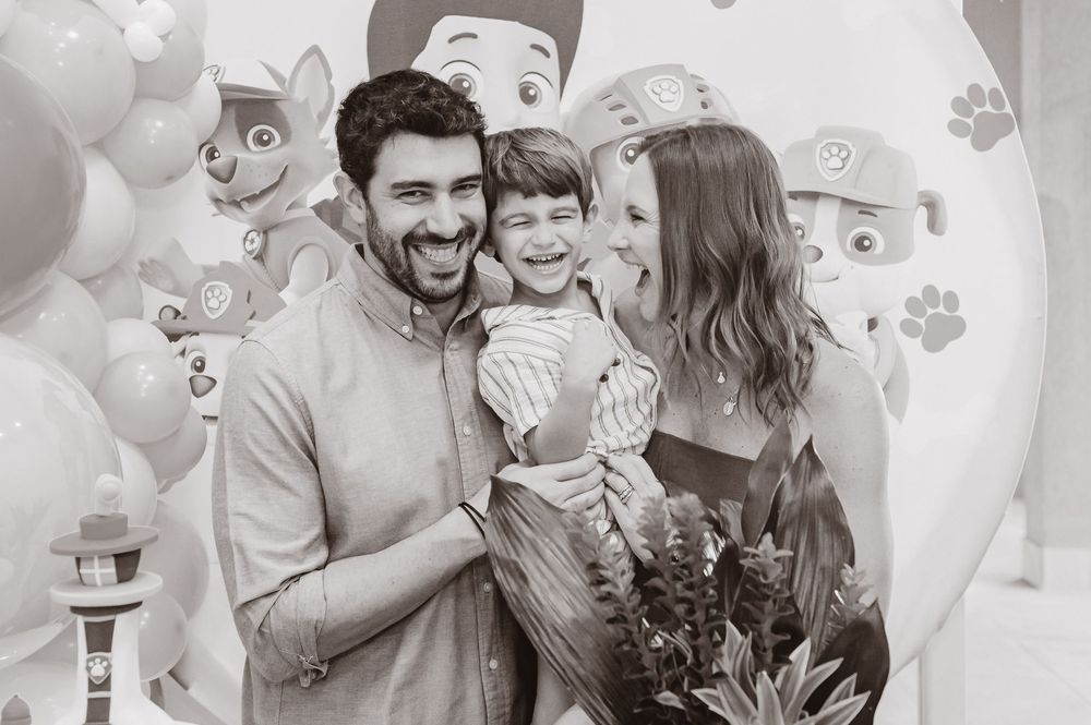 A wedding photo collage showing celebratory moments between loved ones in black and white.