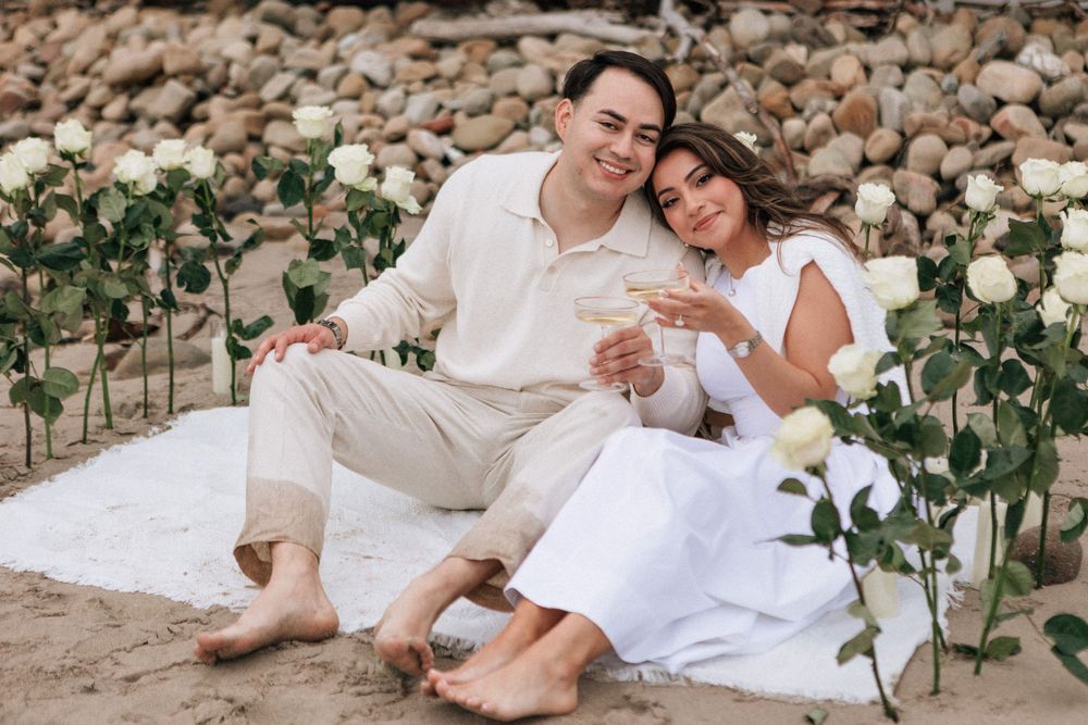 Long-stemmed red roses arranged in sand for a Montecito beach proposal.