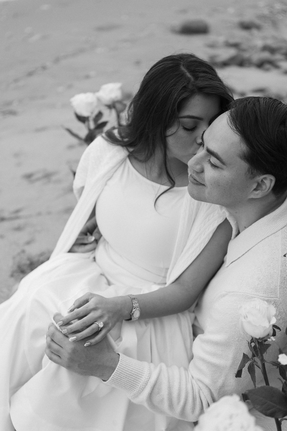 Miramar Beach proposal celebration with champagne toast and roses.