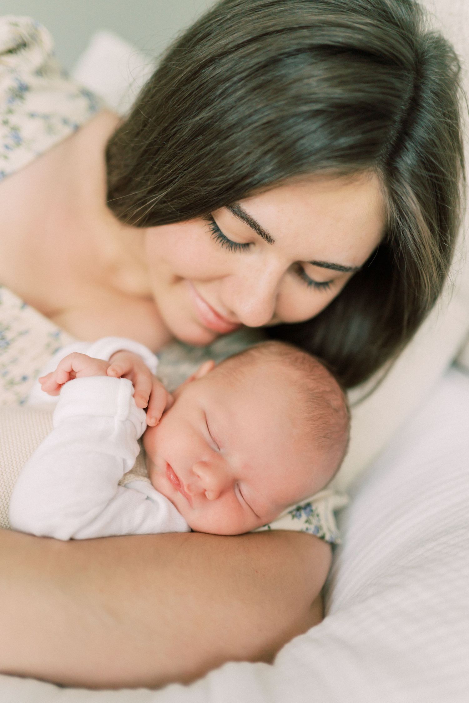 A tender moment captured in a series of intimate lifestyle portraits with soft, natural lighting and muted tones.