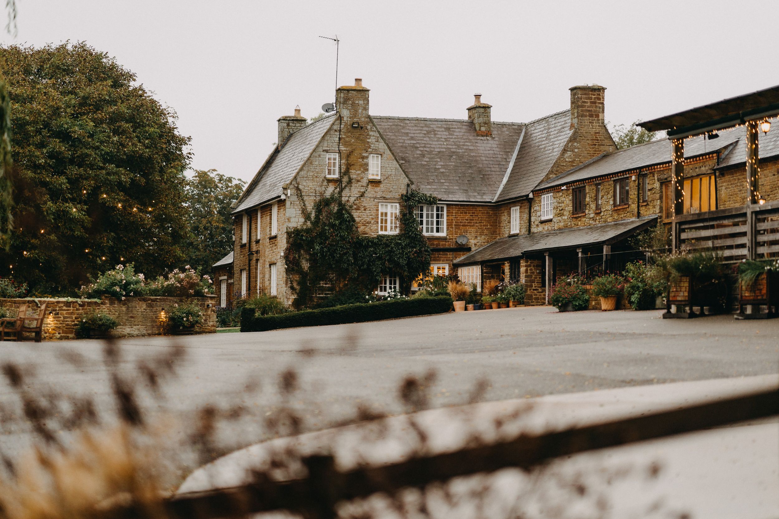 Crockwell Farm - Traditional stone cottage with rustic architecture and landscaping in a countryside setting.