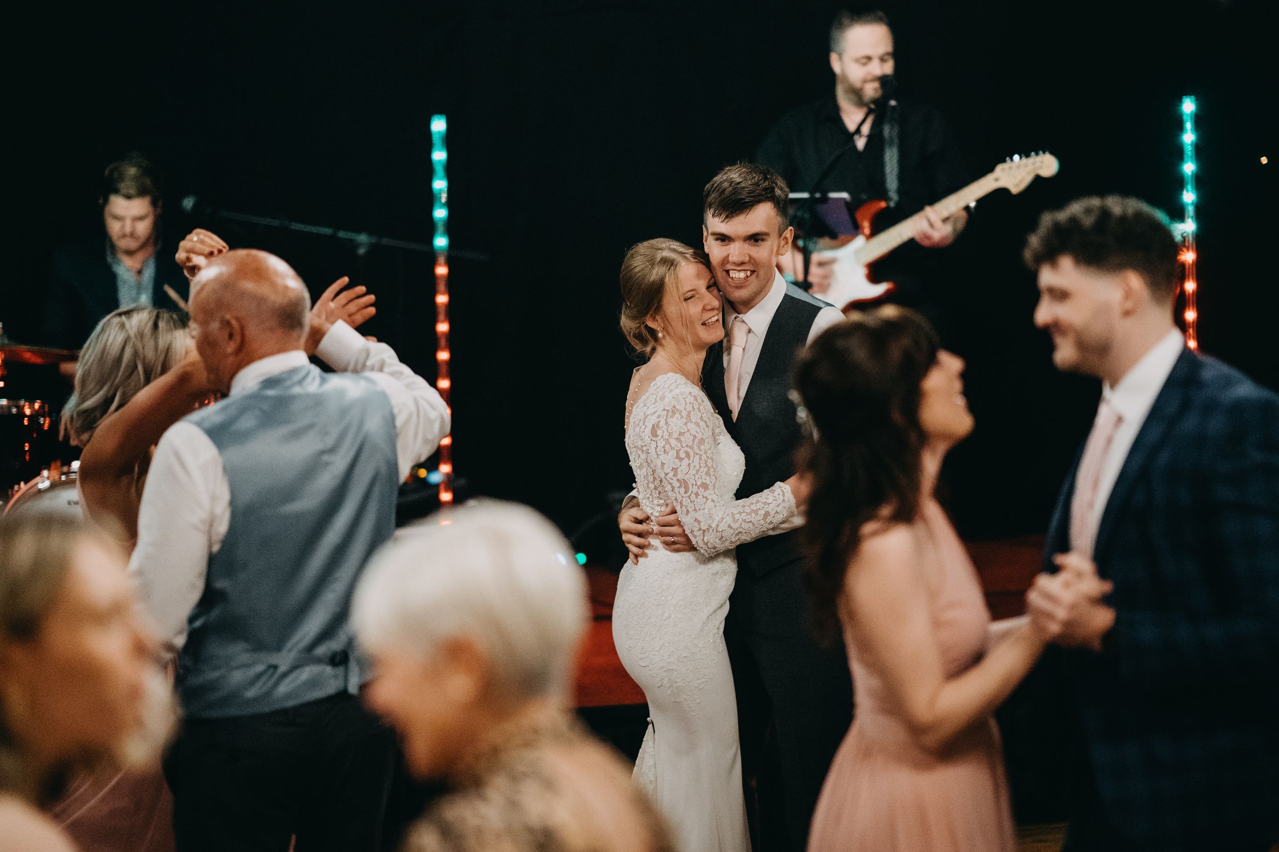 Wedding reception dance floor with live band performing as couples dance at Crockwell Farm.