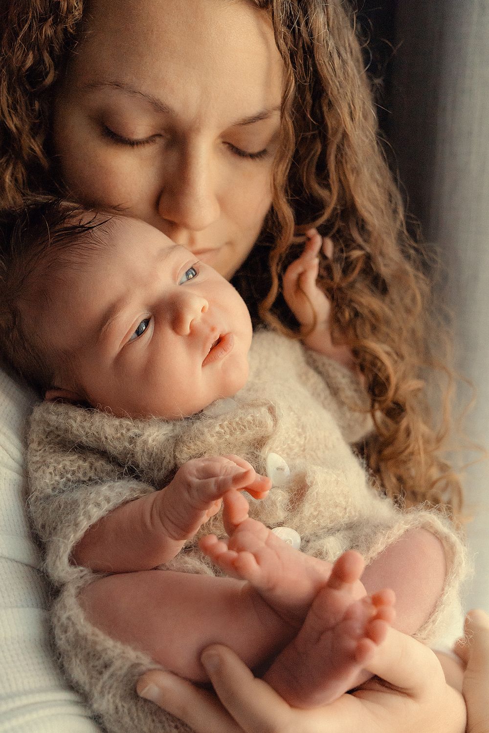 mother and baby portrait during the lifestyle newborn photo session at home using window light in Woodbridge Ontario