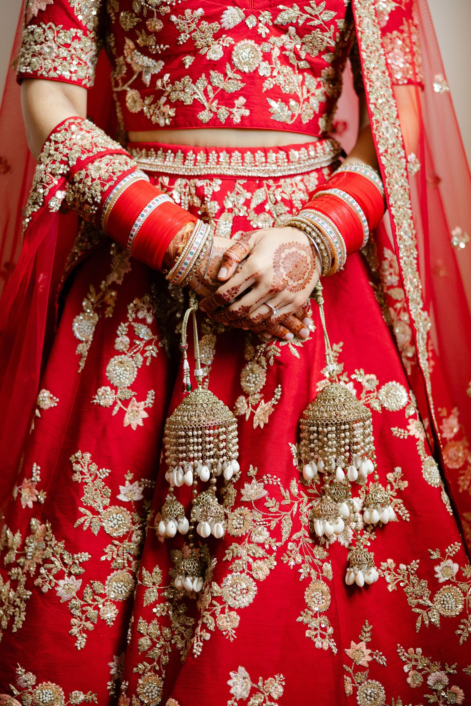 Closeup of Sikh Indian bride's hands with intricate henna details