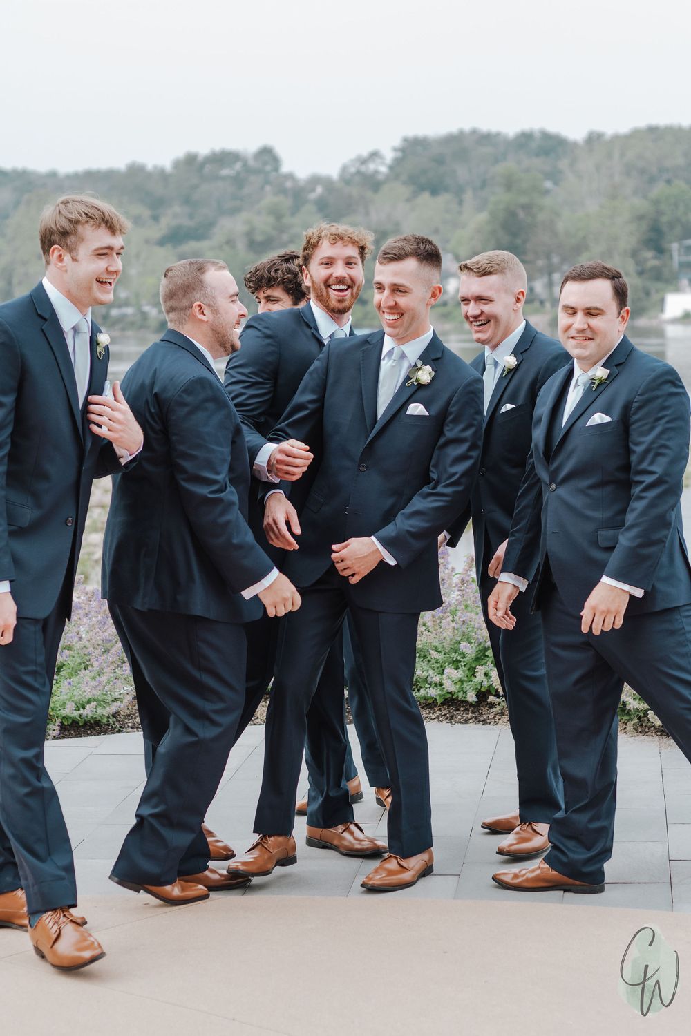 Groomsmen in navy suits and brown shoes share a candid laughing moment in a horizontal progression photo series.