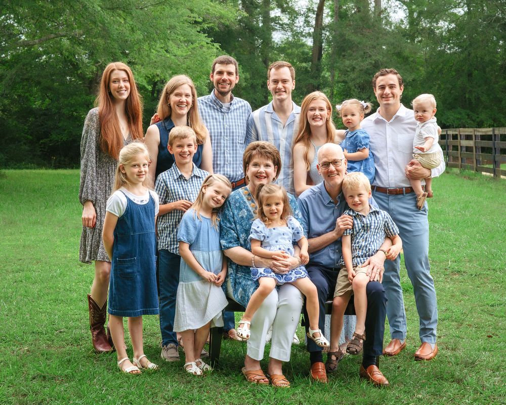 Extended family smiling together during outdoor photography session in Athens, GA