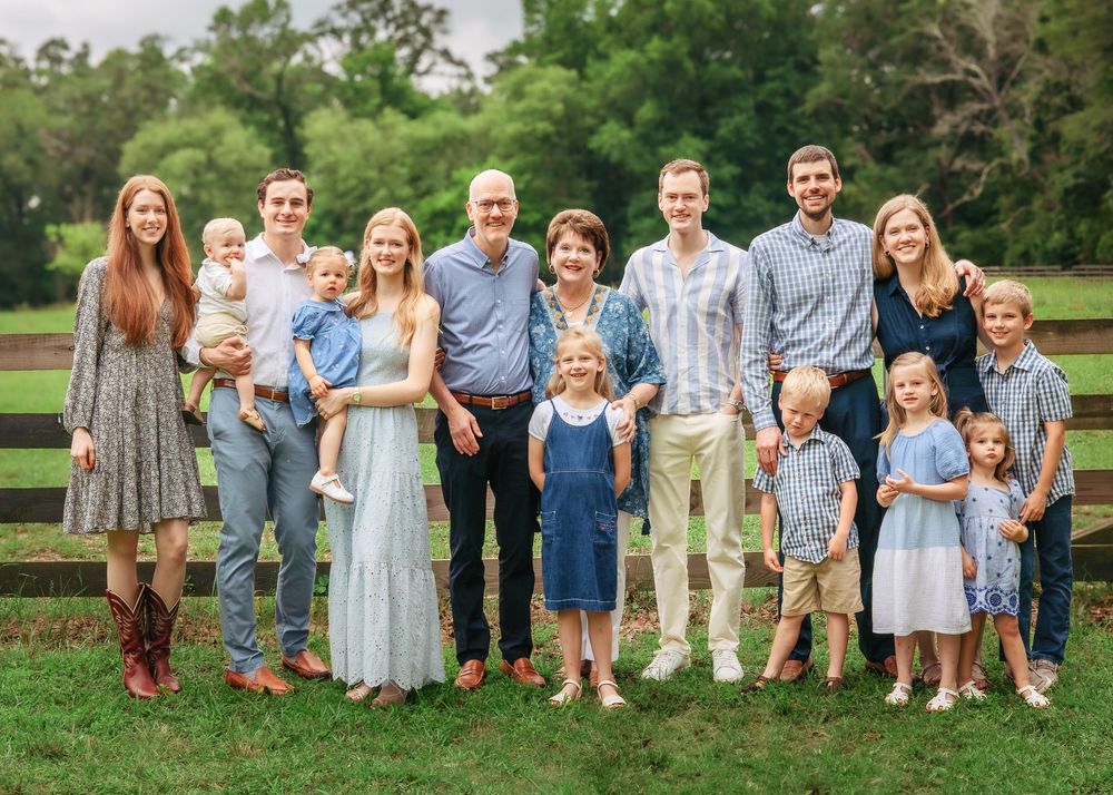 Extended family smiling together during outdoor photography session in Athens, GA
