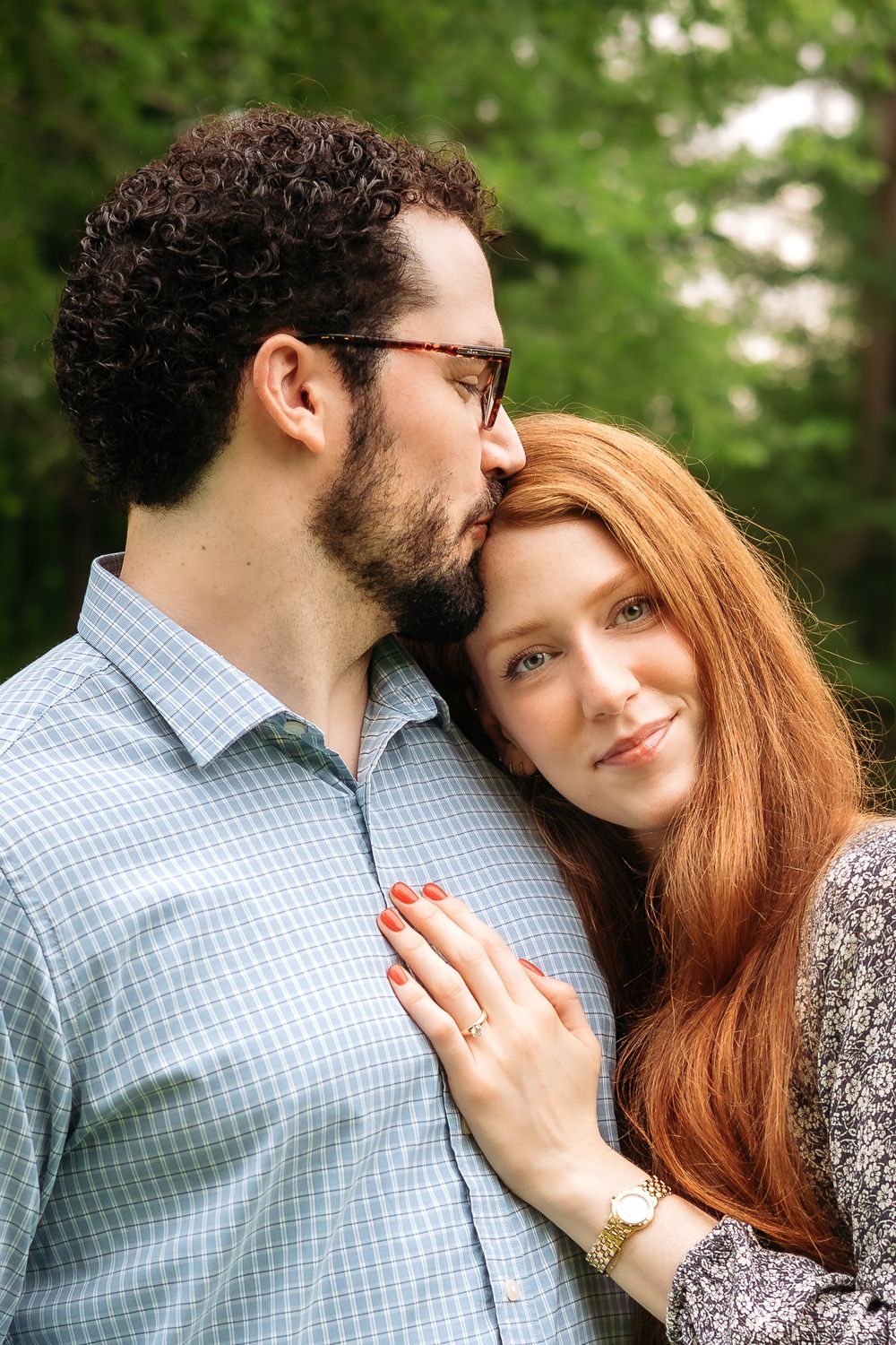 Newly engaged couple poses together during photography session in Athens, GA.