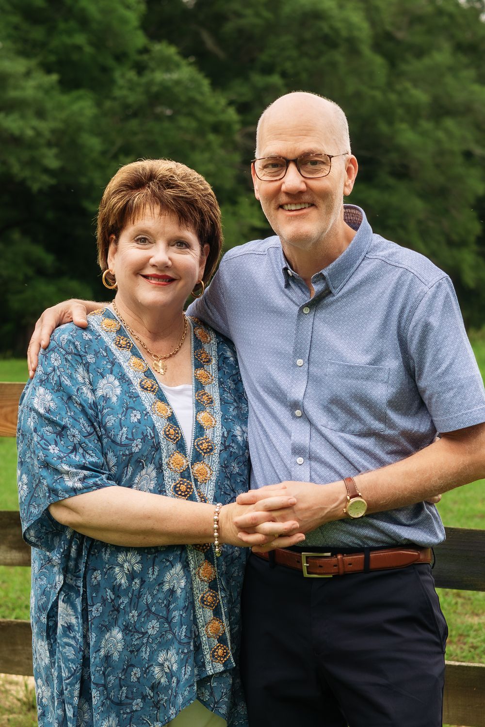 Grandmother and Grandfather smile and hold hands during an extended family session in Athens, GA.