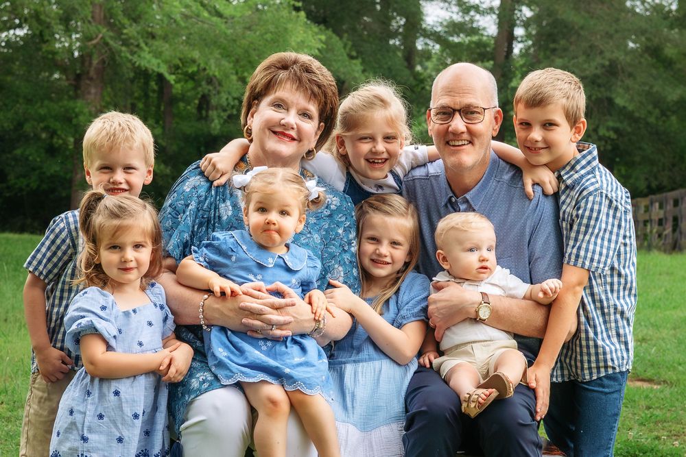 Extended family smiling together during outdoor photography session in Athens, GA